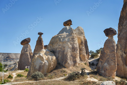 Unique geological rock formations Fairy Chimneys in Cappadocia. Popular touristic area in Turkey