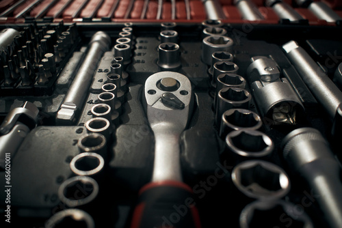 Ratchet and wrench socket in toolkit
