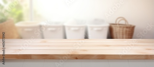 Blank wooden table in blurry Laundry room for showcasing or compiling your items