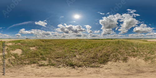 spherical 360 hdri panorama among dry grass farming field with clouds on blue sky in equirectangular seamless projection, use as sky dome replacement, game development as skybox or VR content