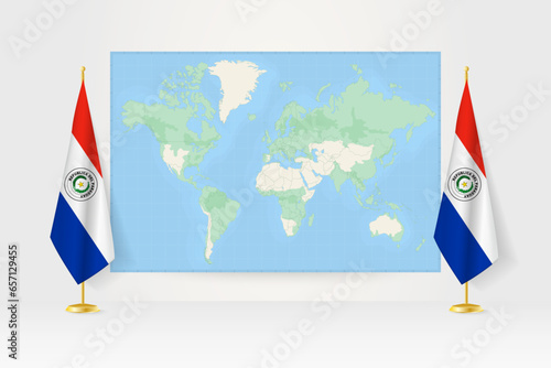 World Map between two hanging flags of Paraguay flag stand.