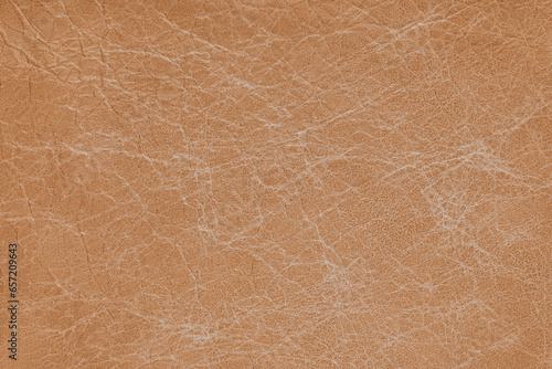 Genuine orange coarse textured leather, eco friendly leatherette background. Material for upholstery and interior design, sport items and clothes. Wallpaper, banner, backdrop.