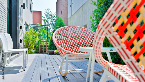 Colorful rattan chairs are always available in resort accommodations