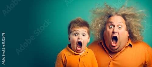 Funny father and son shouting hilariously with exaggerated astonished expressions, isolated on green background