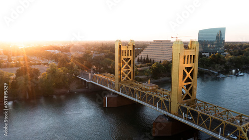 Sunset view of the historic 1935 Tower Bridge and the downtown skyline of Old Sacramento, California, USA.