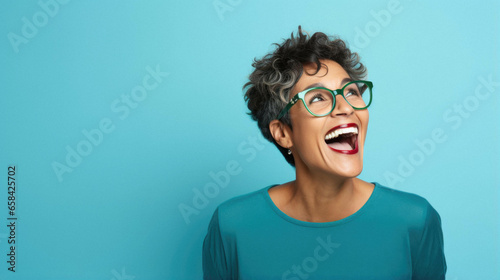 Middle age mature happy beautiful african american woman wearing casual clothes and glasses looking away with excited expression, cheerful and happy face.