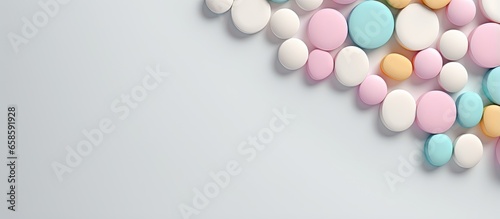 White round medical pills with calcium vitamins closeup on isolated pastel background Copy space with space for text or image