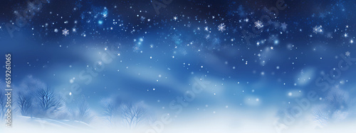 a snow covered blurry background with a blue light