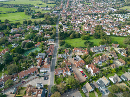 Drone high altitude view of a typical British town. Showing the main through road and residential houses.