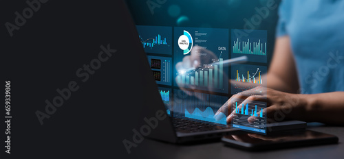 Female analyst uses Work on laptop and dashboard for business analysis, data and data management system with KPIs and indicators connected to database for technology finance. Corporate strategy