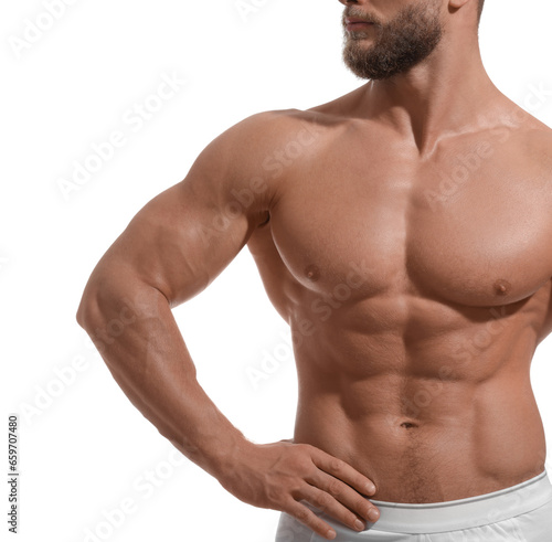 Muscular man showing abs isolated on white, closeup. Sexy body