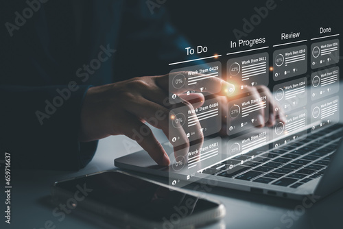 Agile software development or project management using kanban or scrum methodology boards on screen. Process, workflow, visual organisation tools and framework. Developer touching virtual interface.