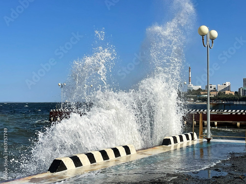Big waves on the Sports embankment in Vladivostok in windy weather