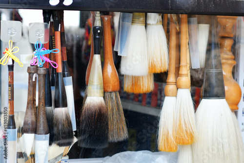 Photo of traditional Chinese writing instruments brushes for sale in a shop
