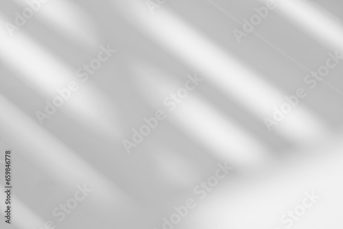 Abstract light reflection and grey shadow from window on white wall background. Gray stripe window shadows and sunshine diagonal geometric overlay effect for backdrop and mockup design