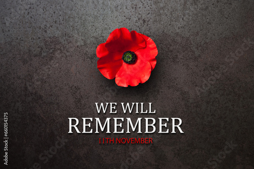 We Will Remember 11th November inscription with Poppy flower on rusty iron background. Decorative flower for Remembrance Day. Memorial Day. Veterans day.