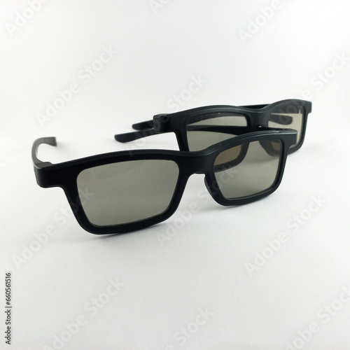 Cinema glasses and black sunglasses isolated on white