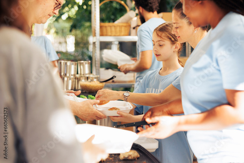 Image showcasing charity workers at outdoor food bank, serving the needy homeless people, providing support and alleviating hunger. Volunteers distributing meal rations to poor individuals.