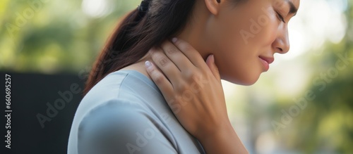 The woman suffers from pain in the neck joints