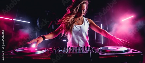 Beautiful woman dj playing at nightclub party lifestyle