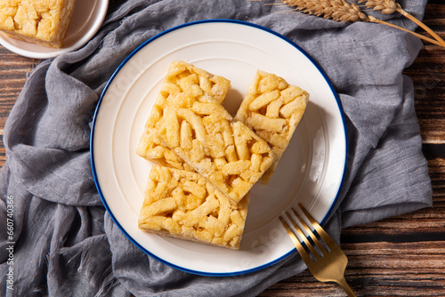 Chinese traditional dessert caramel treats or sachima on table.