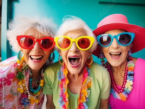 Happy and funny cool old three ladies wearing fashionable bright clothes. Happy and modern Senior women. 