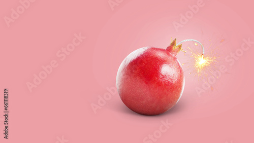 Creative juicy pomegranate bomb with wick and sparks burning, concept. Juicy explosion of vitamin and health, creative idea. Healthy eating and diet