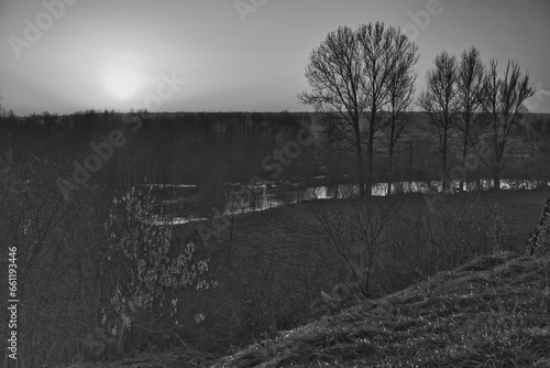 end of the day at the Wieprz river valley during winter season