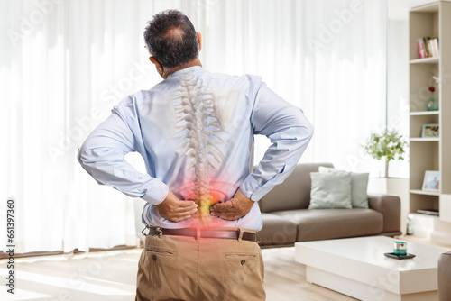 Man with osteoarthritis suffering from back pain