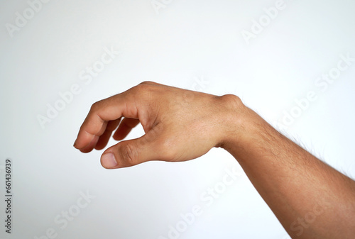 Ganglion cyst on man's hand on white background