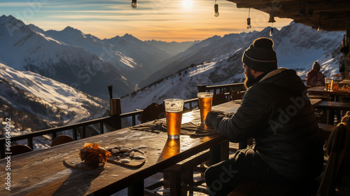 a person sits at a mountain ski resort