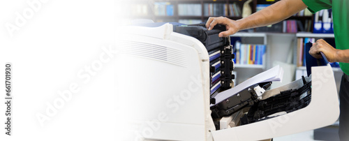 Technician hand open cover photocopier or photocopy to fix repair copier problem paper jam and replace ink cartridges for scanning fax or copy document in office workplace concept of service support.