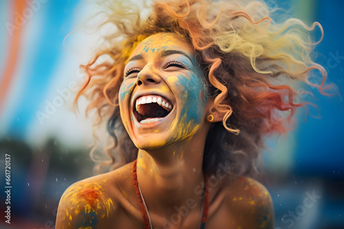 Vibrantly diverse young woman with colorful hair laughs heartily, celebrating positivity.