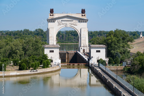 View of the arch of the first shipping lock of the Volga-Don Canal on a sunny June day, Volgograd. Russia