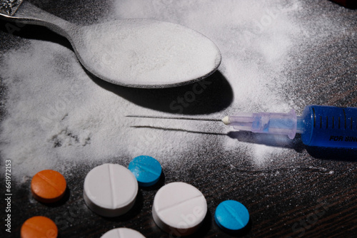 Closeup of cocaine and injection, illegal drugs