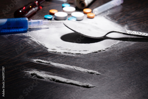 Closeup of cocaine with spoon and syringe