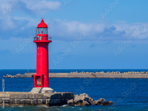 A red lighthouse standing at Wakkanai Port in Wakkanai City, Hokkaido, Japan 