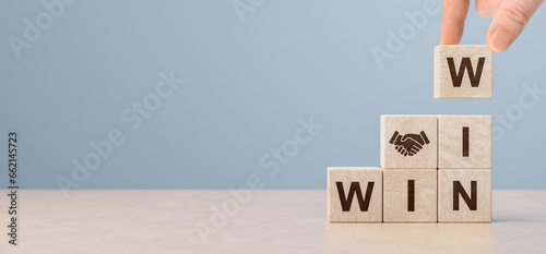 Cubes with handshake icon and win-win situation. Wooden cubes stack with text win-win situation. copy space