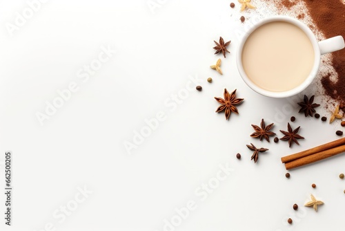 Indian drink with black tea milk species creatively displayed on a white background from a top view