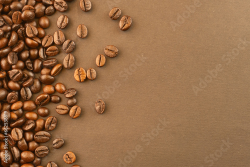 Coffee beans on brown background isolated