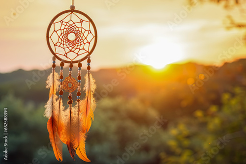 Indian dream catcher hanging in the morning light with a blurred background