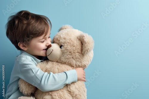 a child hugging a teddy bear