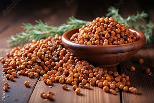 pile of roasted chickpeas on an oak wooden table