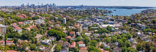 Panoramic aerial drone view above the harbourside suburb of Double Bay in east Sydney, NSW Australia looking toward Darling Point, Sydney Harbour and Sydney City on a sunny day