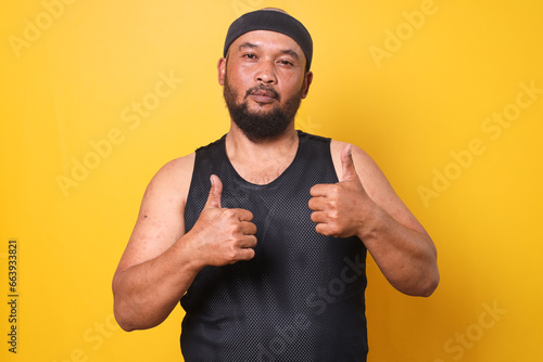 Happy bald fat man showing thumbs up motivating you to exercise