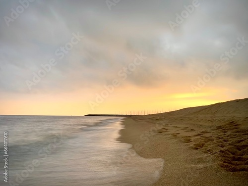 beautiful sunset on the beach of premia de mar, spain