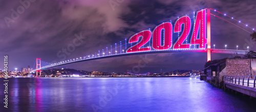 15 July Martyrs Bridge, violet, purple cloudy sky and sea in Istanbul, Turkey. Bosphorus Bridge, Panorama, long exposure, 2024 happy new year. Copy Space.