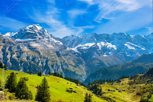 Traditional alpine village in touristic valley Lauterbrunnen, Switzerland attraction