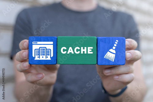 Man holding colorful blocks sees word: CACHE. Cleaning browser from trash files. Deleting documents with cleansing software. Cache and spam concept for website design or landing web page.