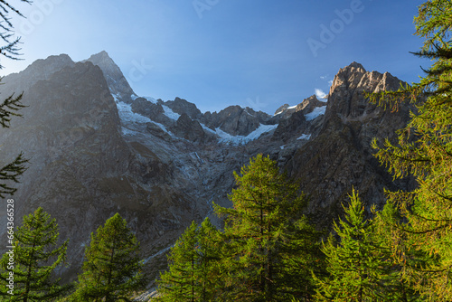 The panorama of Val Ferret, one of the wildest and most spectacular areas of the Italian Alps, near the town of Courmayeur, Valle d'Aosta, Italy - October 2, 2023.